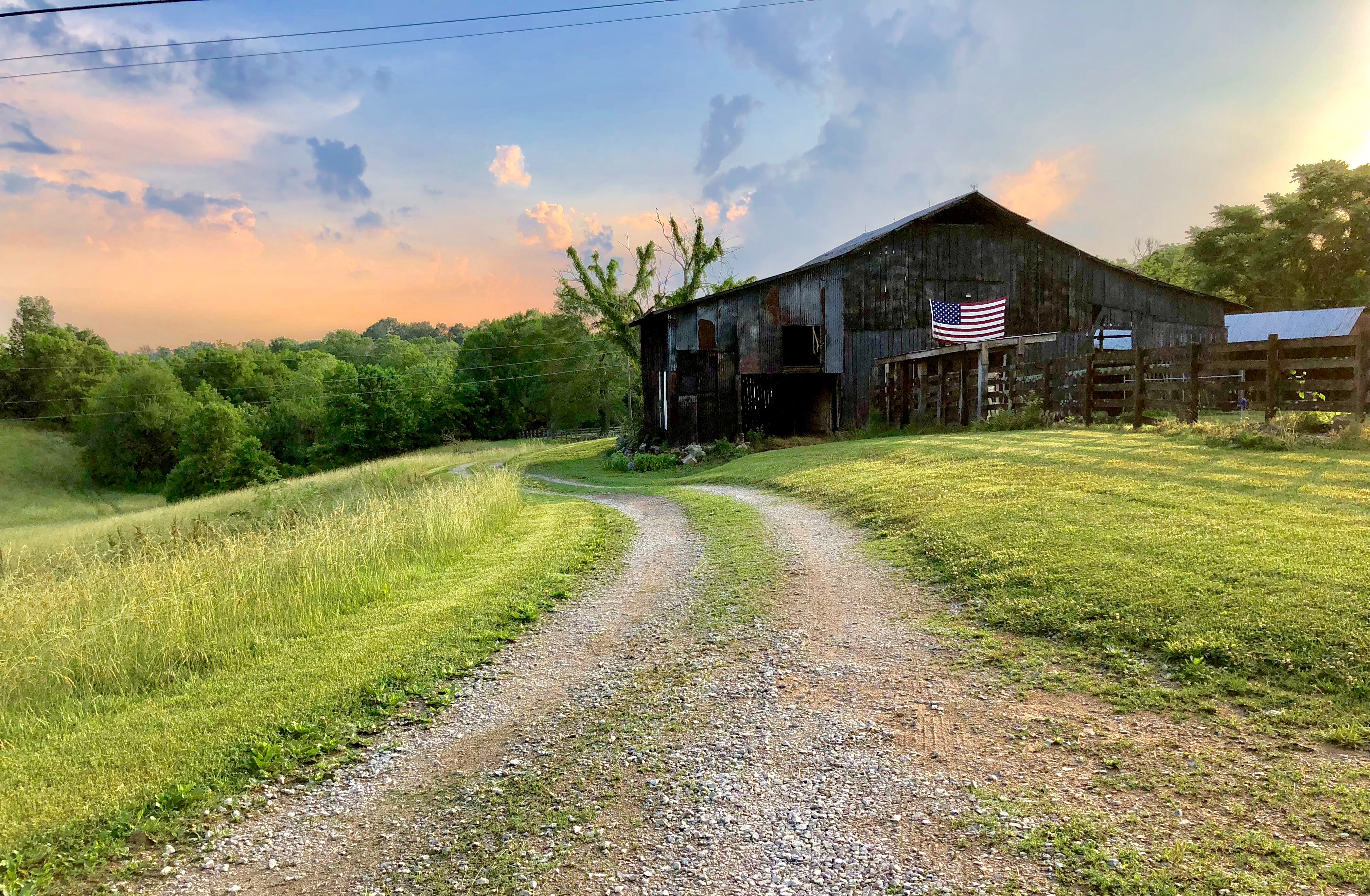 Photo of a barn with U.S. flag on it